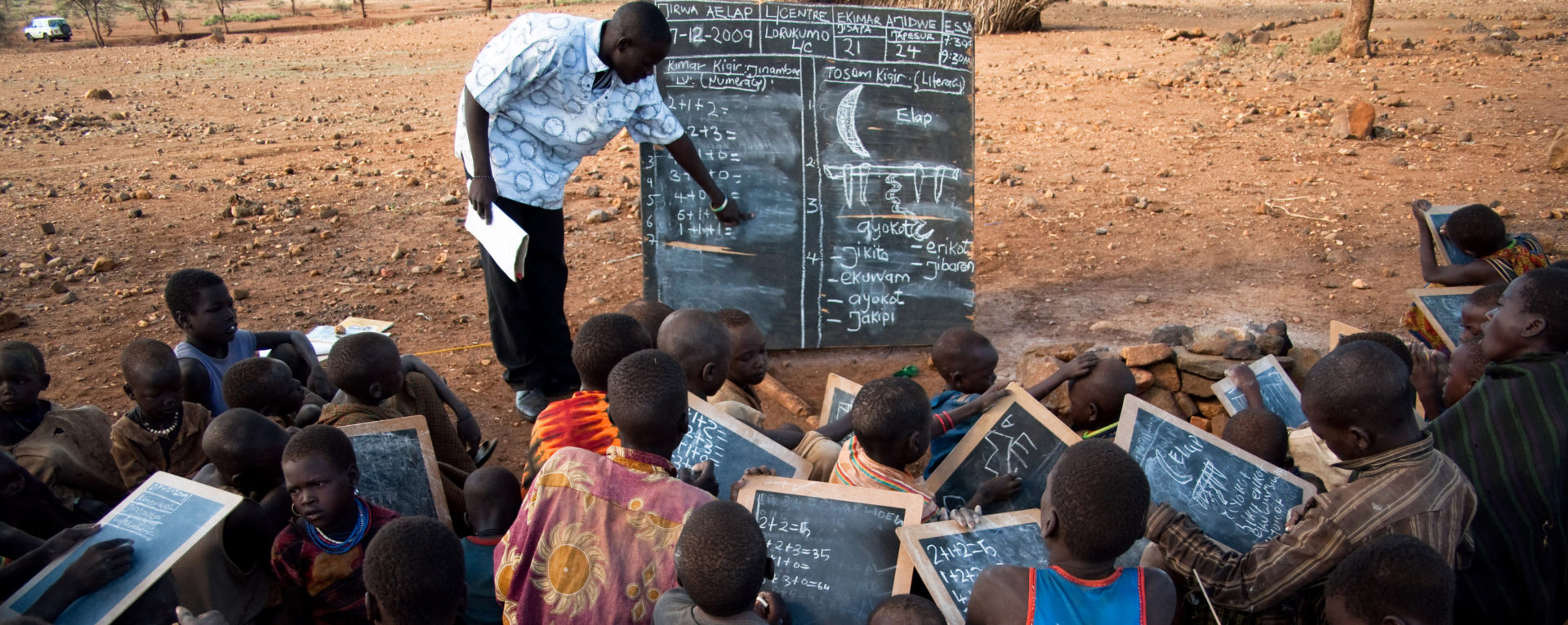 Instead of using notbooks and pens, teachers and students in Karamoja turn to chalk boards, a cheaper and better suited option in this very dry climate.